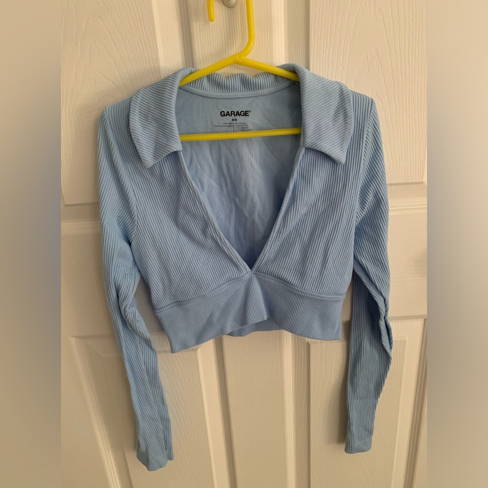 Size medium, light blue, deep v neck collared crop top from garage.